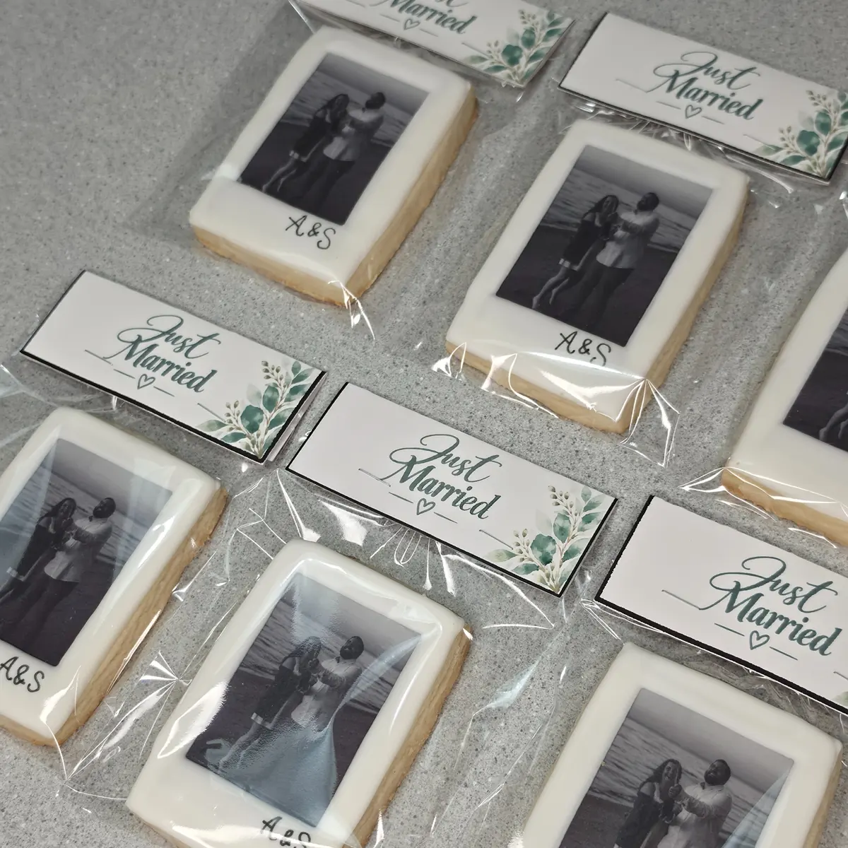 Printed cookies, each sealed in a clear bag with a printed tag